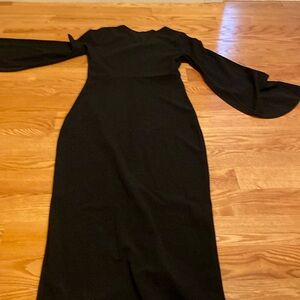 Classic black dress with bell sleeve nwot size M but runs snug